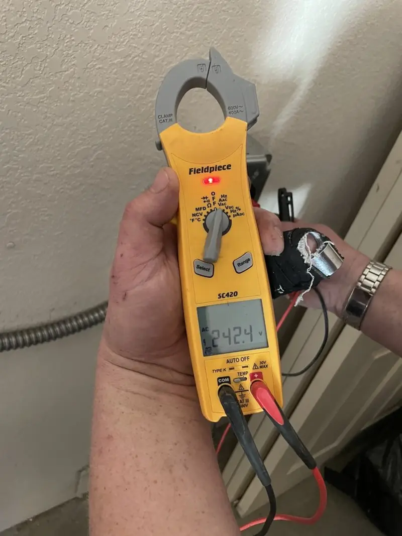 Voltage testing with clamp meter during Circuit Breaker Repair in Kearney